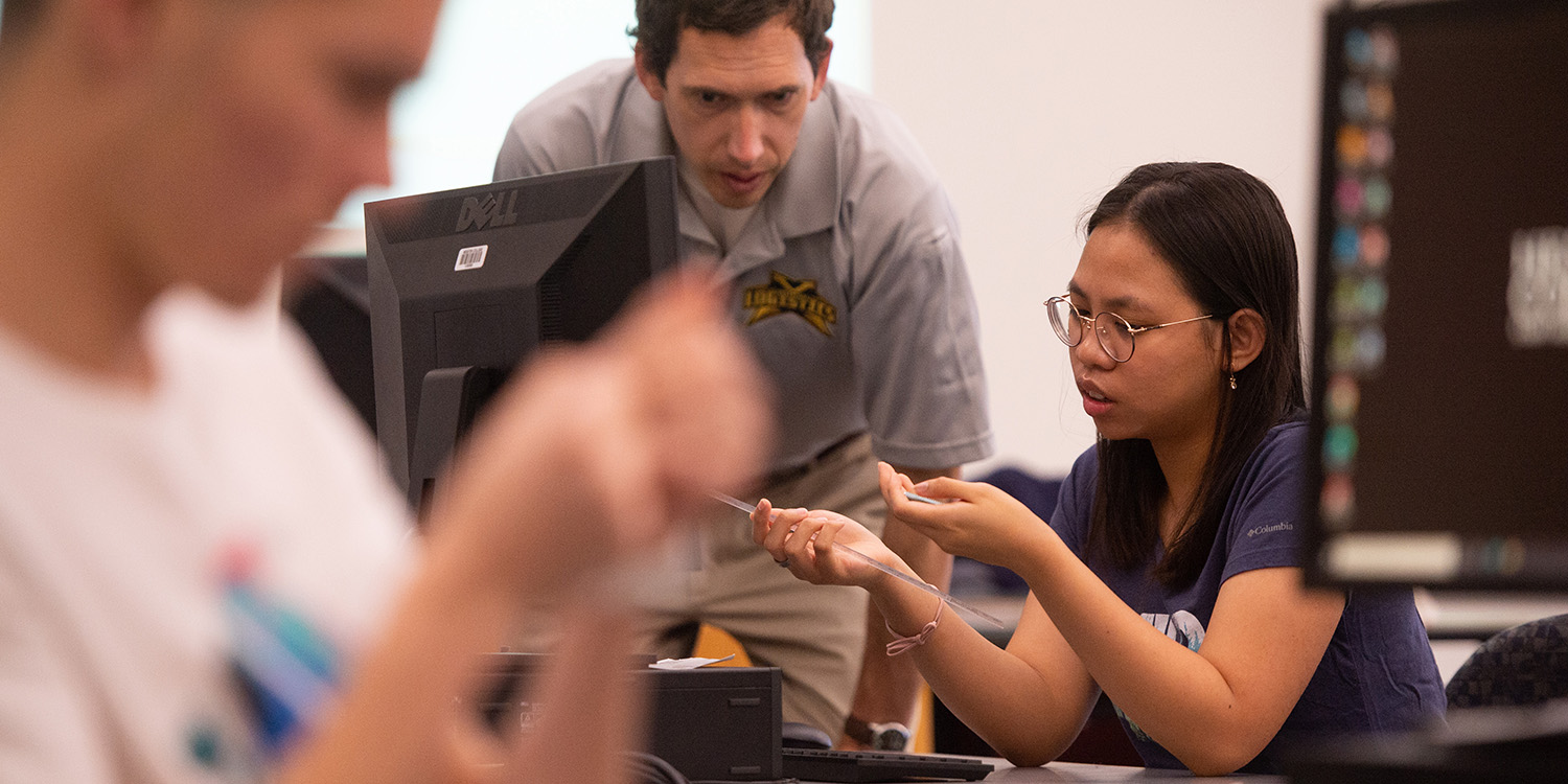 Director of the School of Engineering Johann Reimer works with sophomore Jessica Raharjo in Engineering Graphics class.