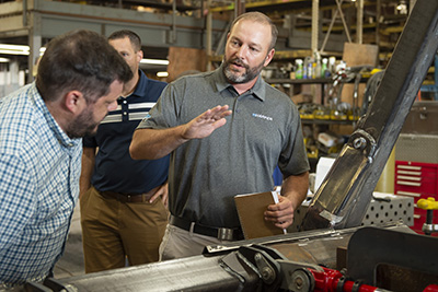 Drew Gerber ’04 discusses the  Harper hydraulics system.