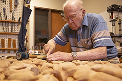Paul Friesen carving in his studio. Photo by Jon Friesen