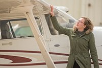 An aviation student works through their preflight checklist.