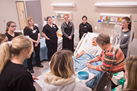 Nursing students practive in the skills lab.