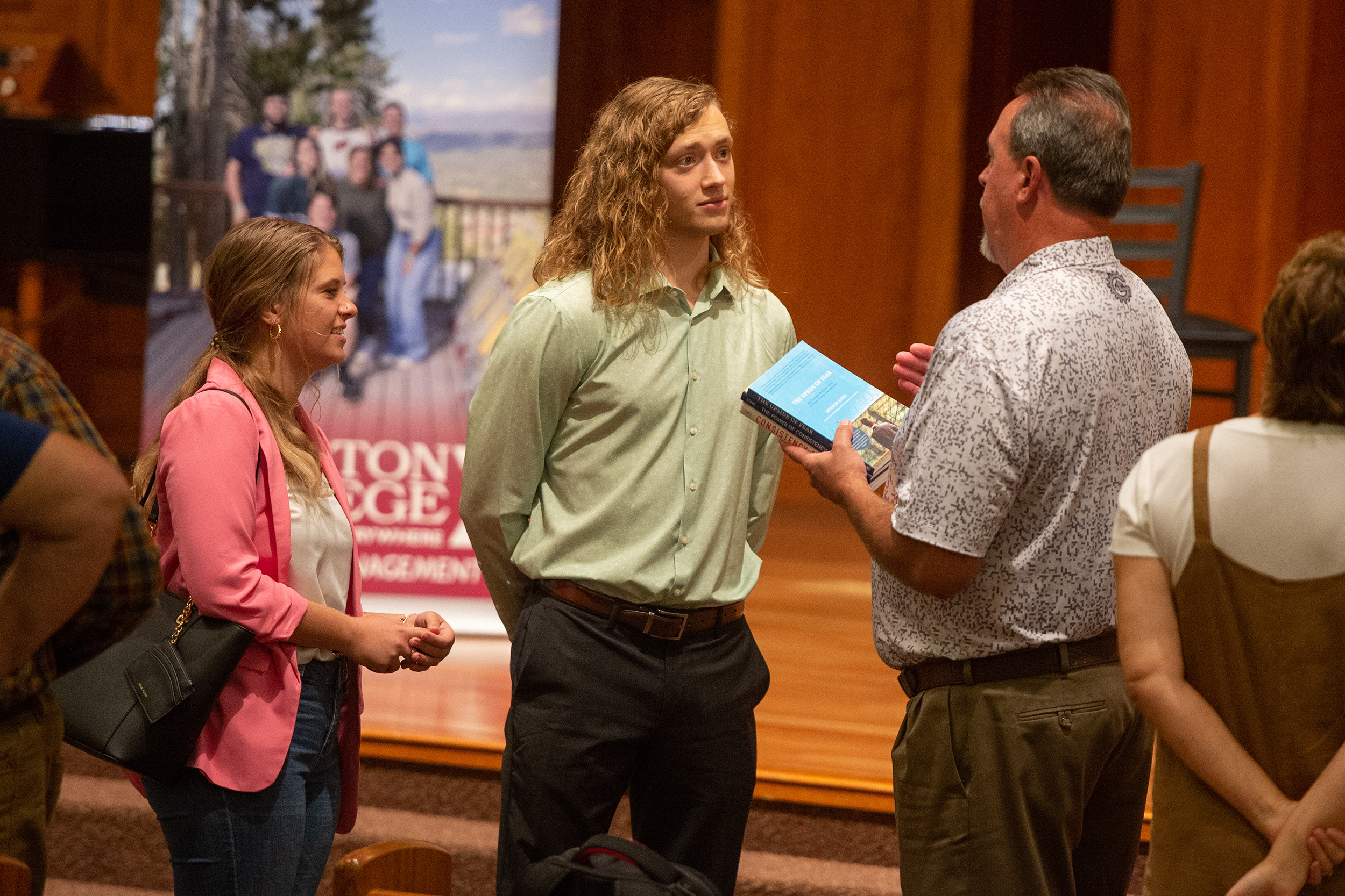 Students visit with panel members at the business alumni panel discussion at Hesston College Homecoming 2022