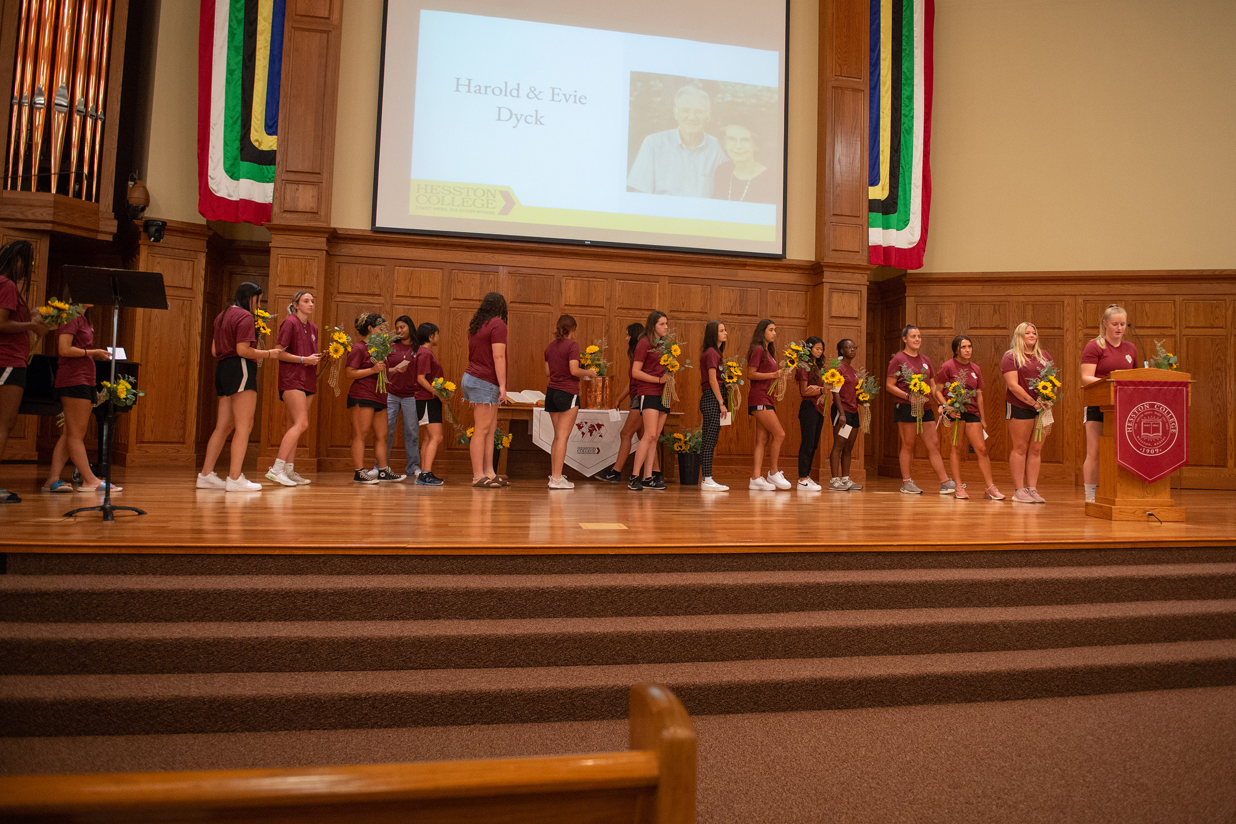 Students presented flowers in honor of all charter Partners at the Partner lunch at Hesston College Homecoming 2022