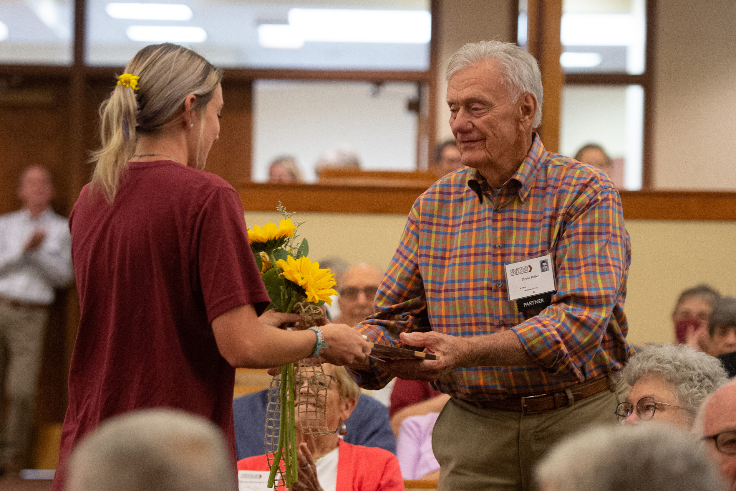 Students presented flowers and special cutting board to charter Partners at the Partner lunch at Hesston College Homecoming 2022