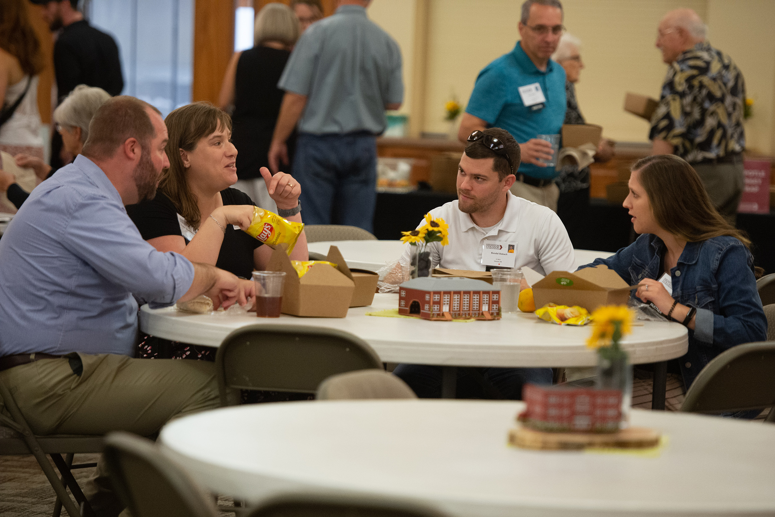 Students presented flowers in honor of all charter Partners at the Partner lunch at Hesston College Homecoming 2022