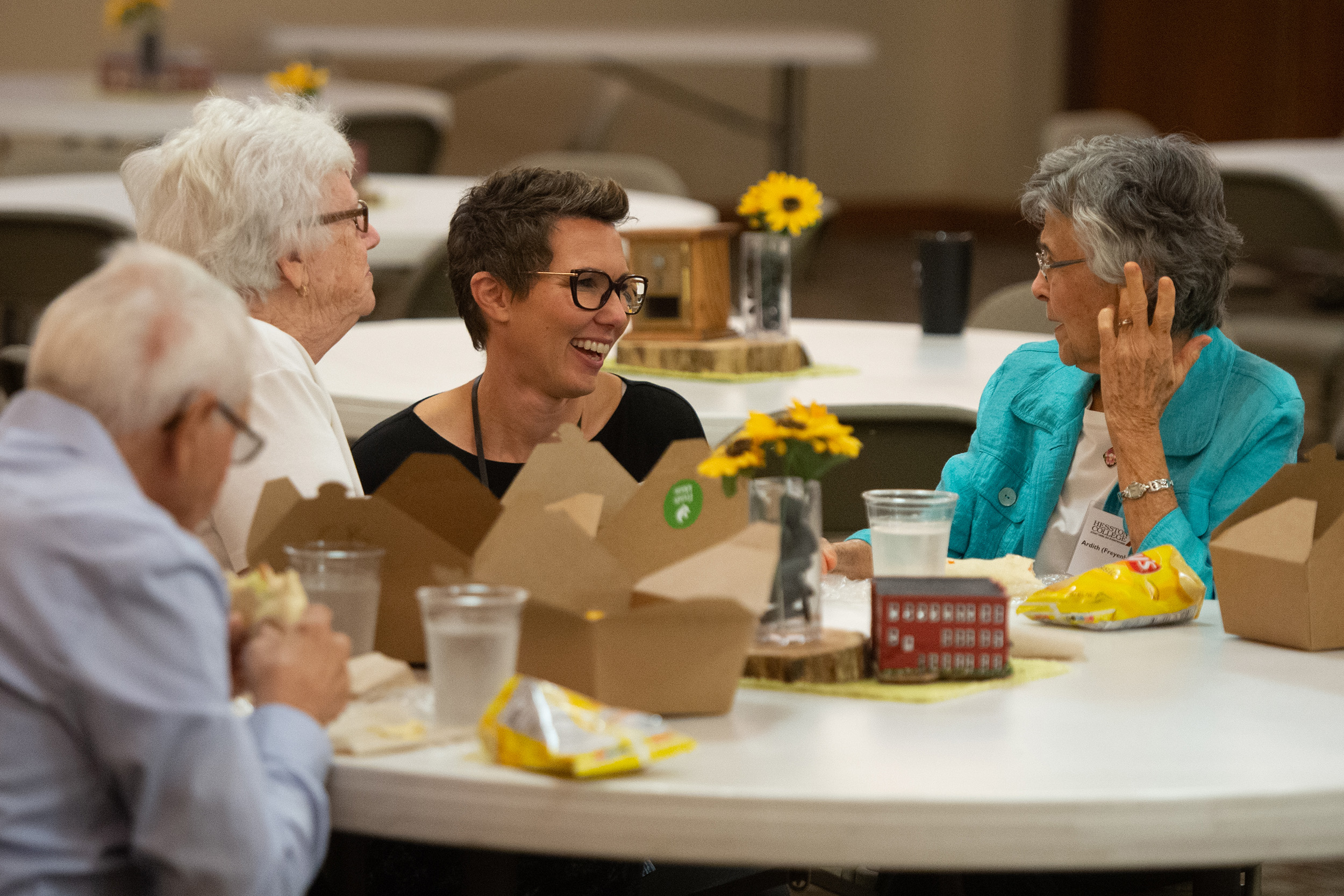 Students presented flowers in honor of all charter Partners at the Partner lunch at Hesston College Homecoming 2022