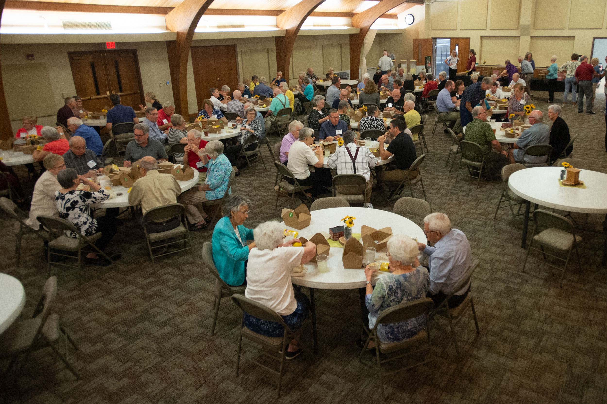 Students presented flowers in honor of all charter Partners at the Partner lunch at Hesston College Homecoming 2022