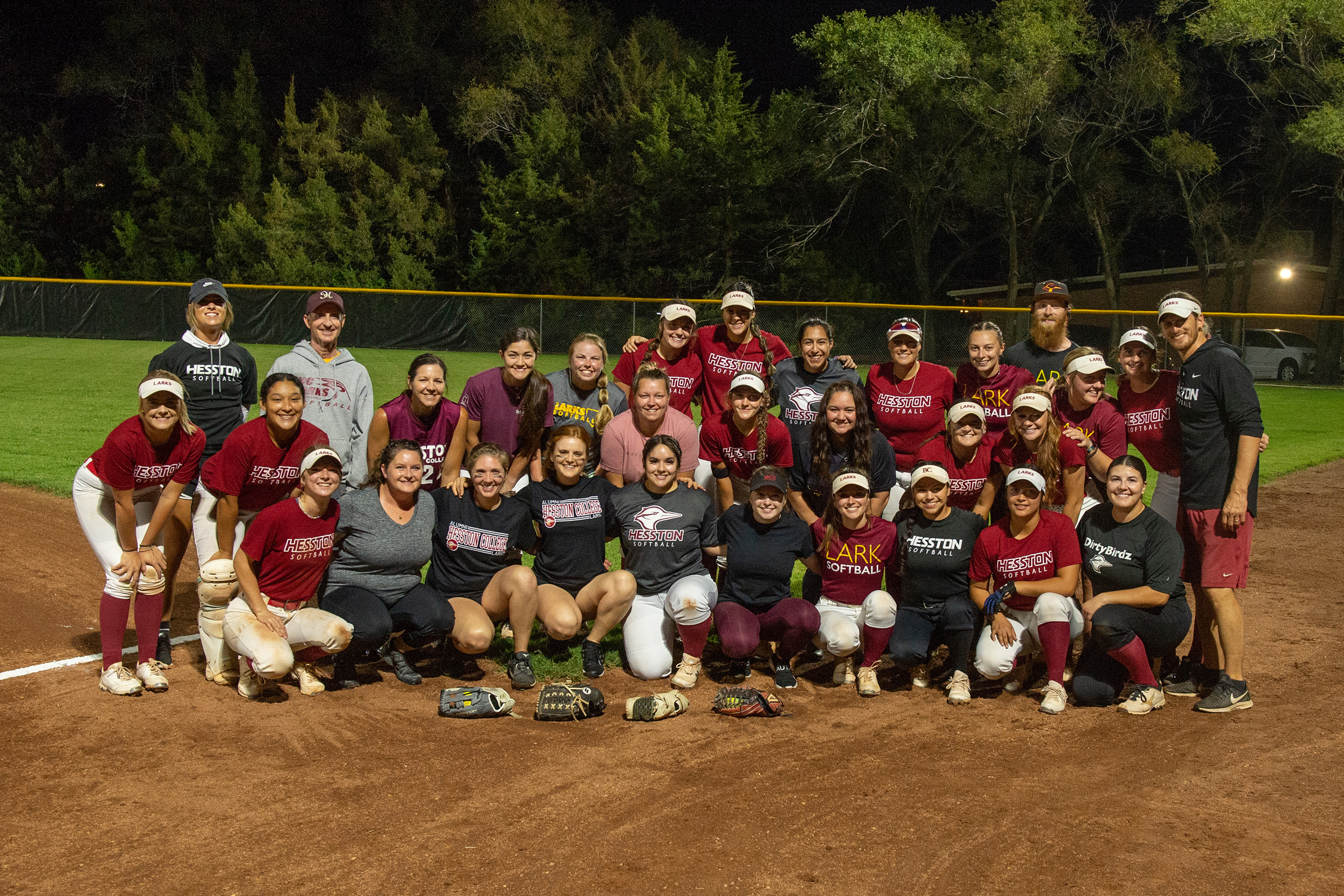 The teams for the alumni vs varsity softball game at Hesston College Homecoming 2022