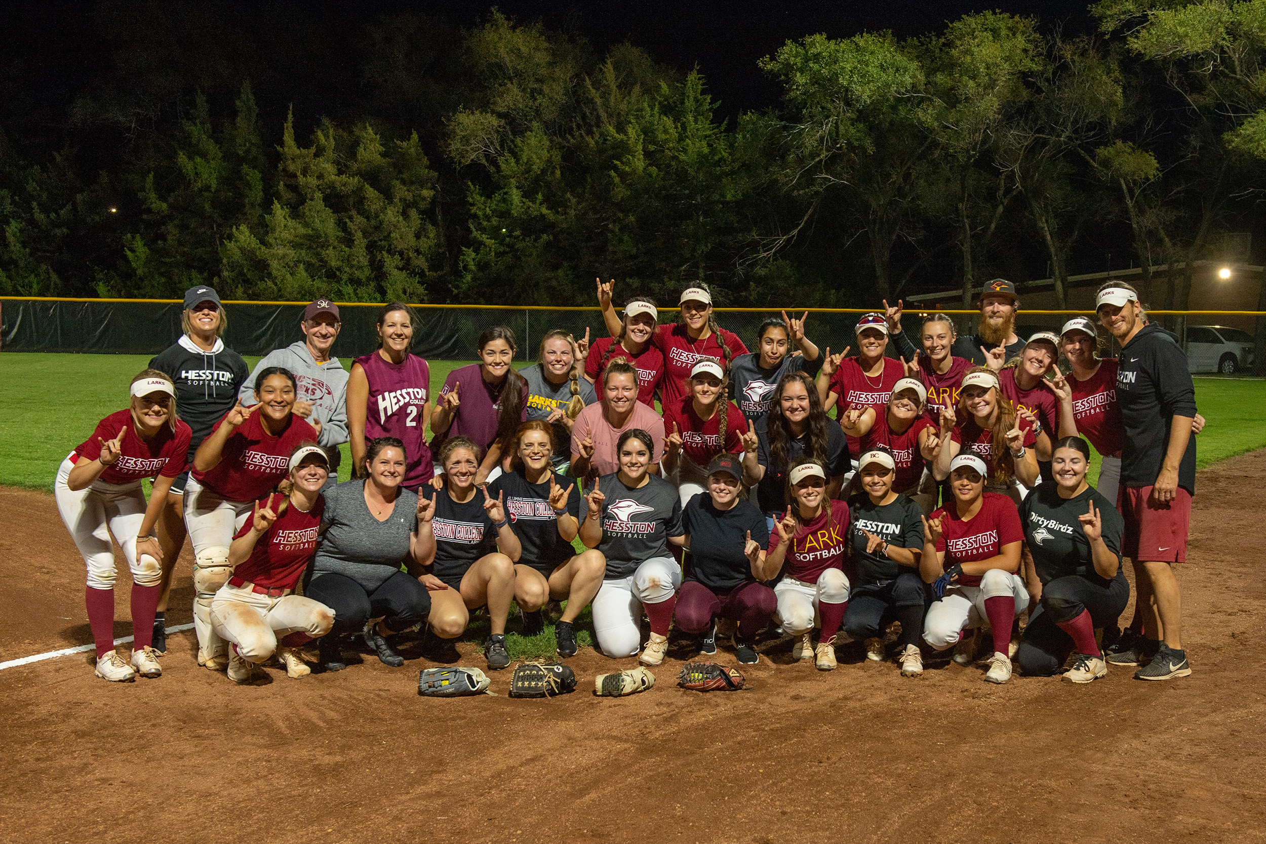 The teams for the alumni vs varsity softball game at Hesston College Homecoming 2022