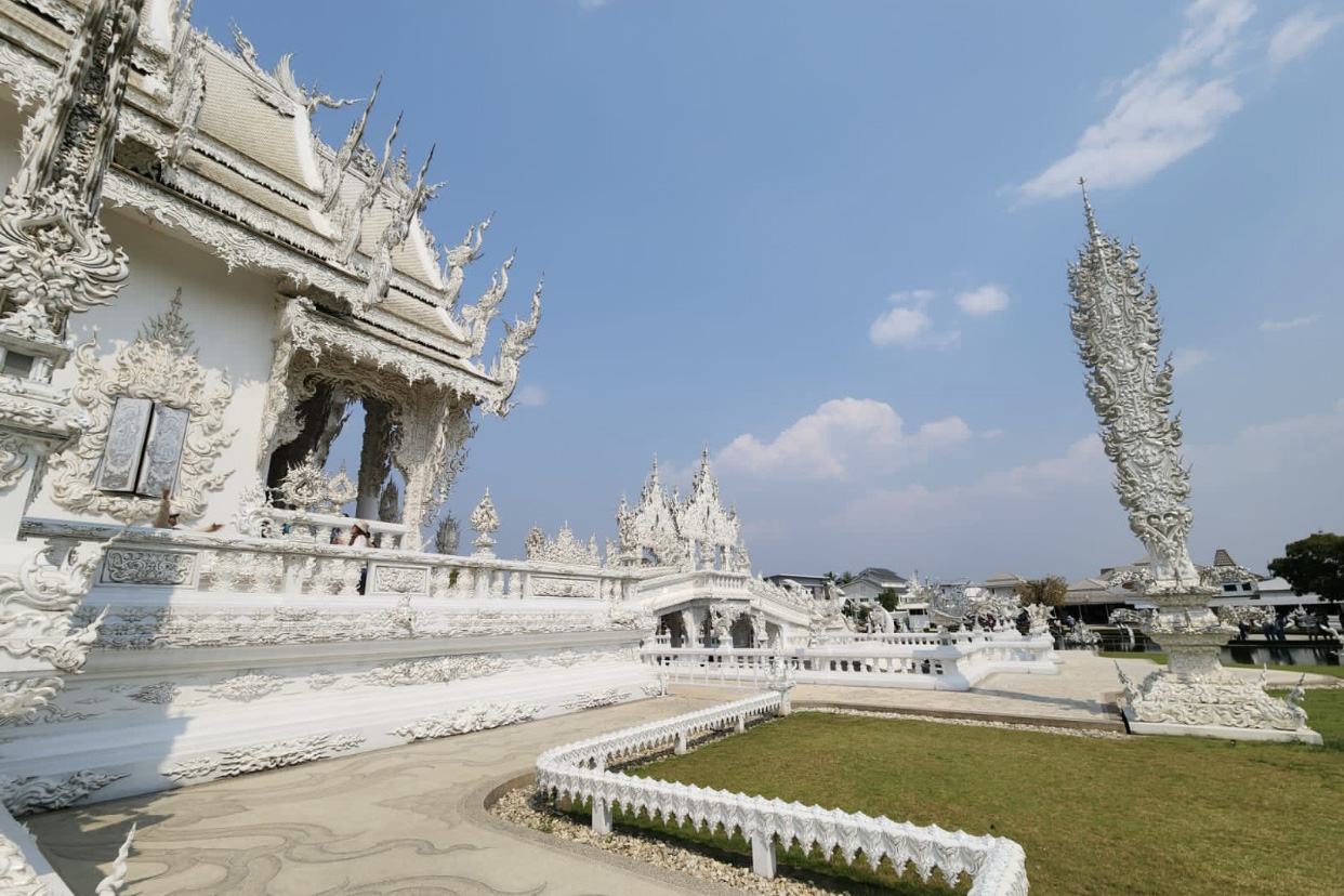 On the other side of the bridge at the White Temple which is depicted by the sacred temple itself.