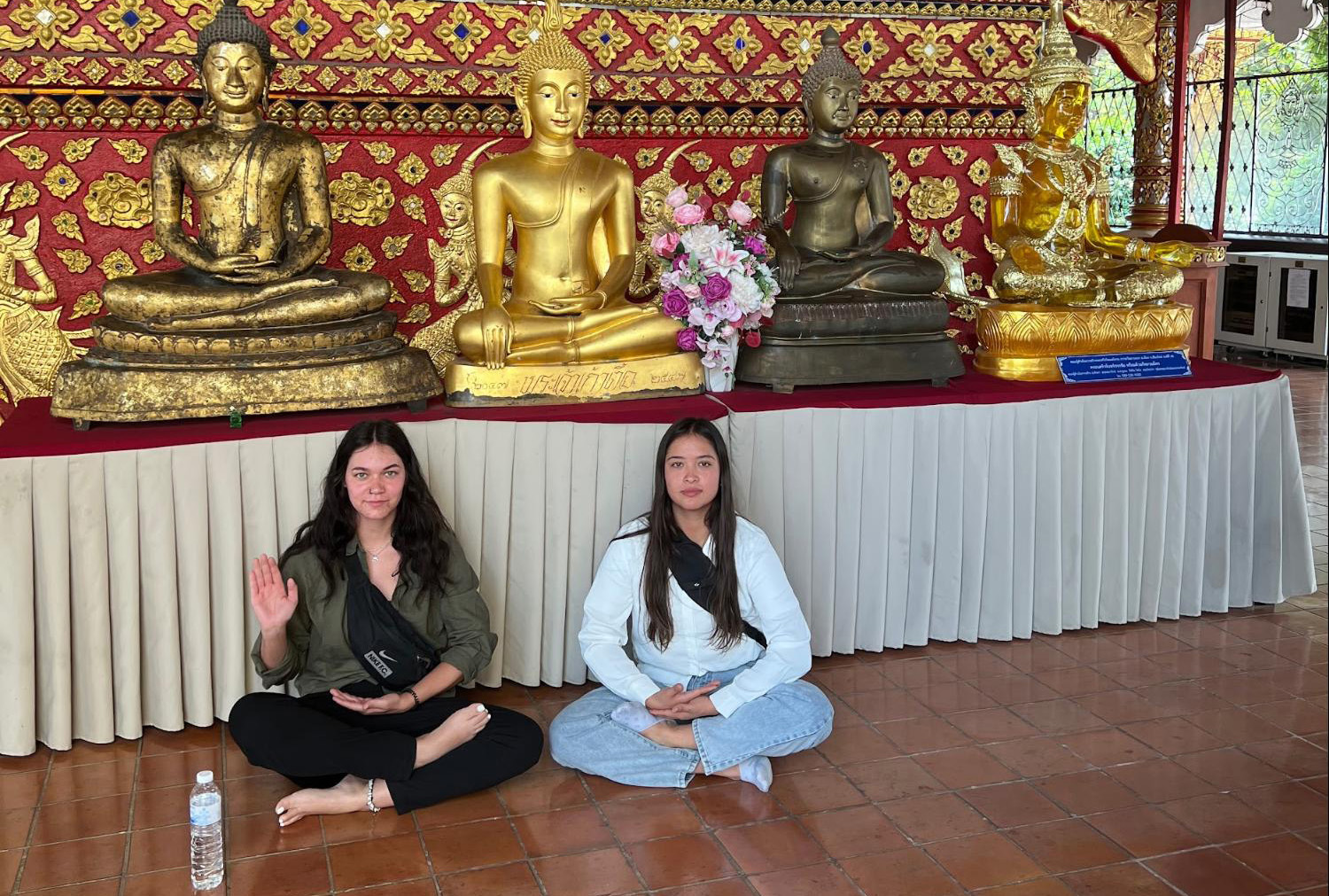 In the back of the Temple Aydan and Mari posed with the Buddha statues.