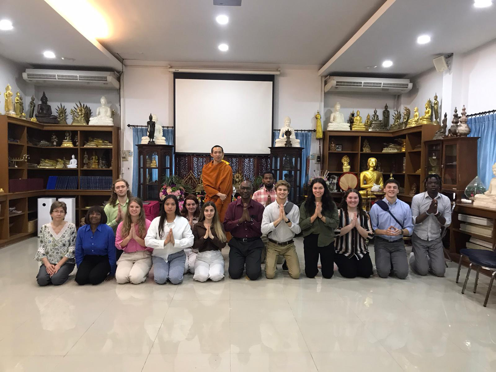 This is our group with the Monk that we had a monk chat with. He was very good about answering our many questions.