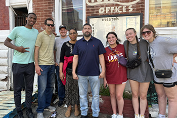 Bryce Blake, Johann Reimer, Keith Showalter, Wideline Charles, Juan Marrero, Emily Miller, Smilla Burklin and Kelbe Edwards at Crossroads Community Center in Fairhill hood.