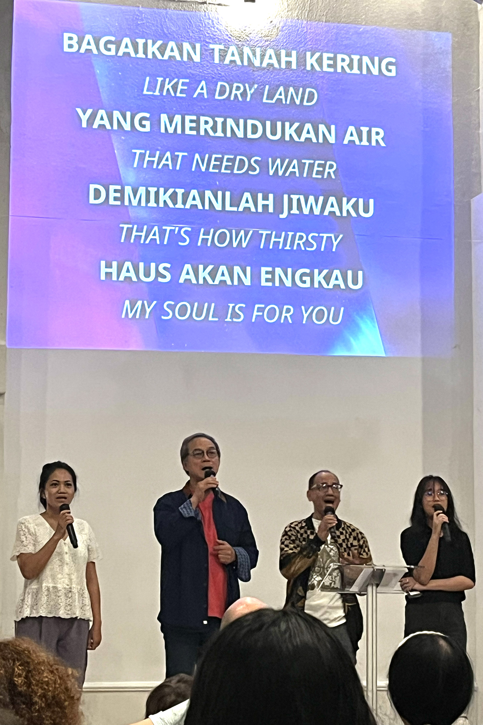 Photo - Singing in Indonesian and English at the Pentecost service at Philadelphia Praise Center.