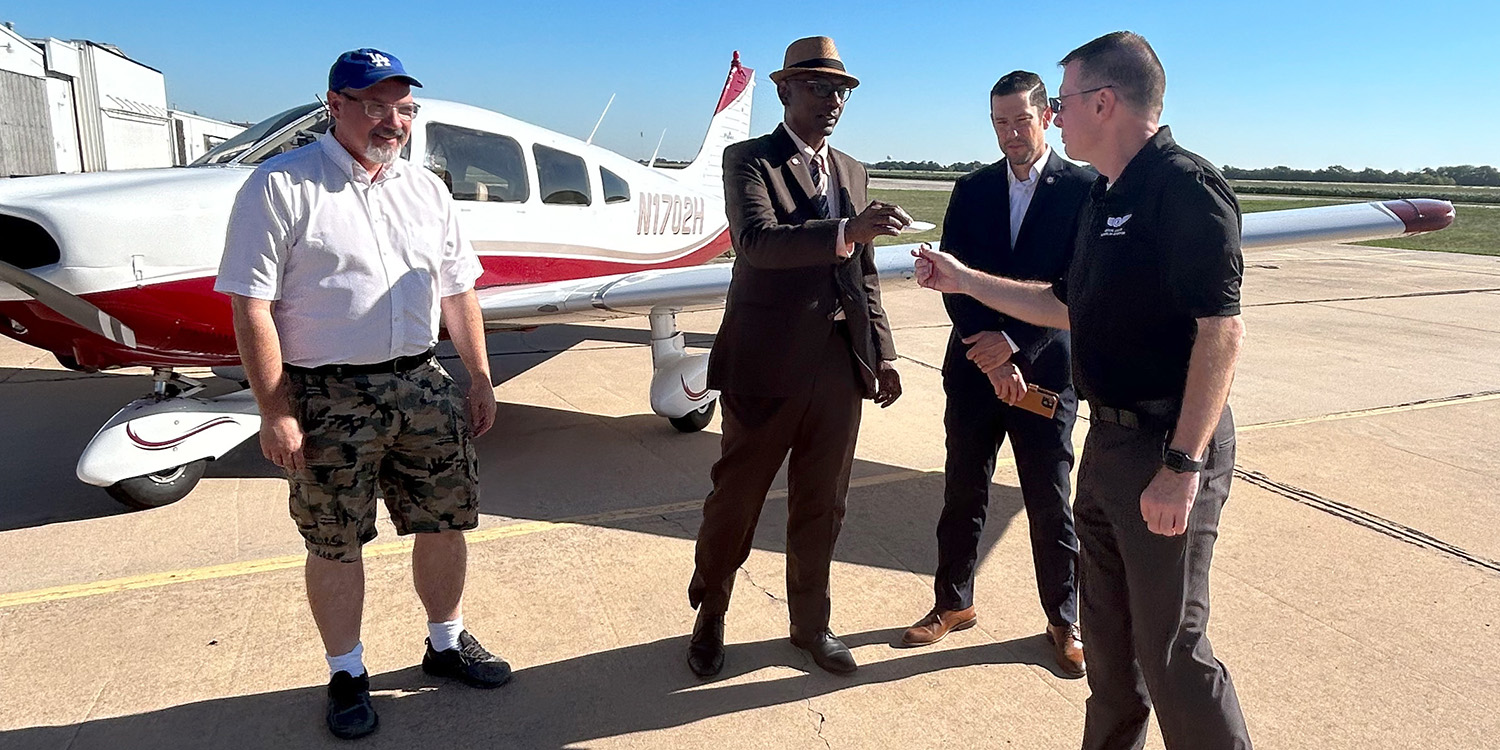 photo - President Joseph A. Manickam hands the new archer airplane keys to Mike Baker, director of the School of Aviation, accompanied by Caleb Loss, vice president of finance, and a representative of Tomahawk Aero Services.