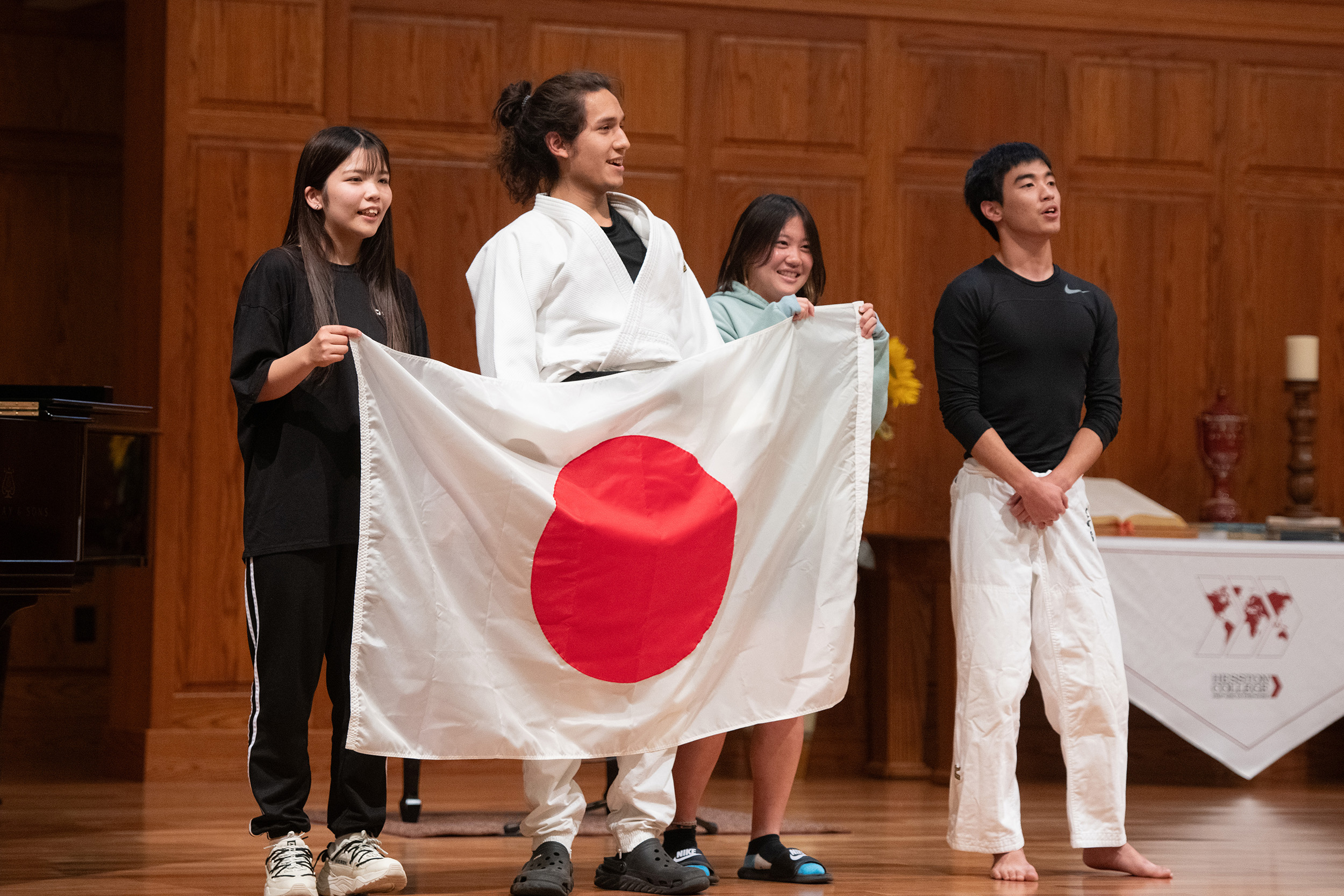photo - 2023 Hesston College Cultures Fair - students from Japan singing Japan's national anthem