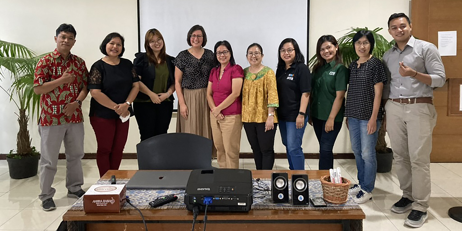 Hesston College faculty member Heidi Hochstetler (fourth from left) poses with faculty member at Universitas Kristen Satya Wacana in Salatiga, Central Java