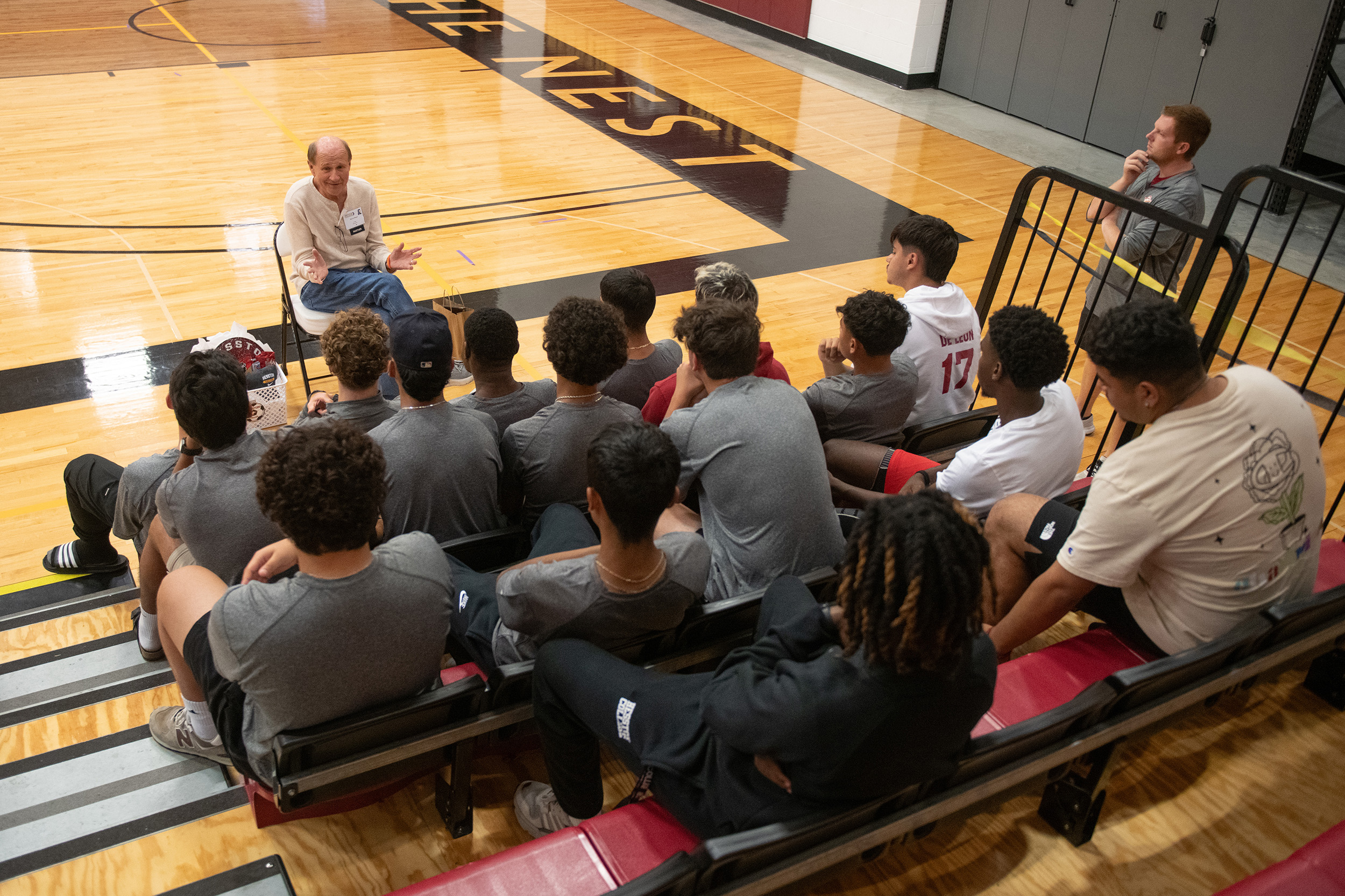 photo - Hesston College Homecoming 2023 - Athletics HoF inductees speak to teams - Gerry Sieber and men's soccer