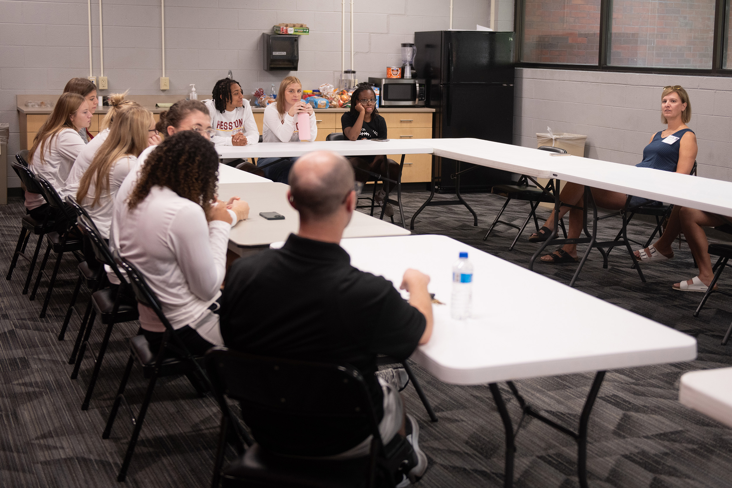 photo - Hesston College Homecoming 2023 - Athletics HoF inductees speak to teams - Lisa Schmidt and women's basketball