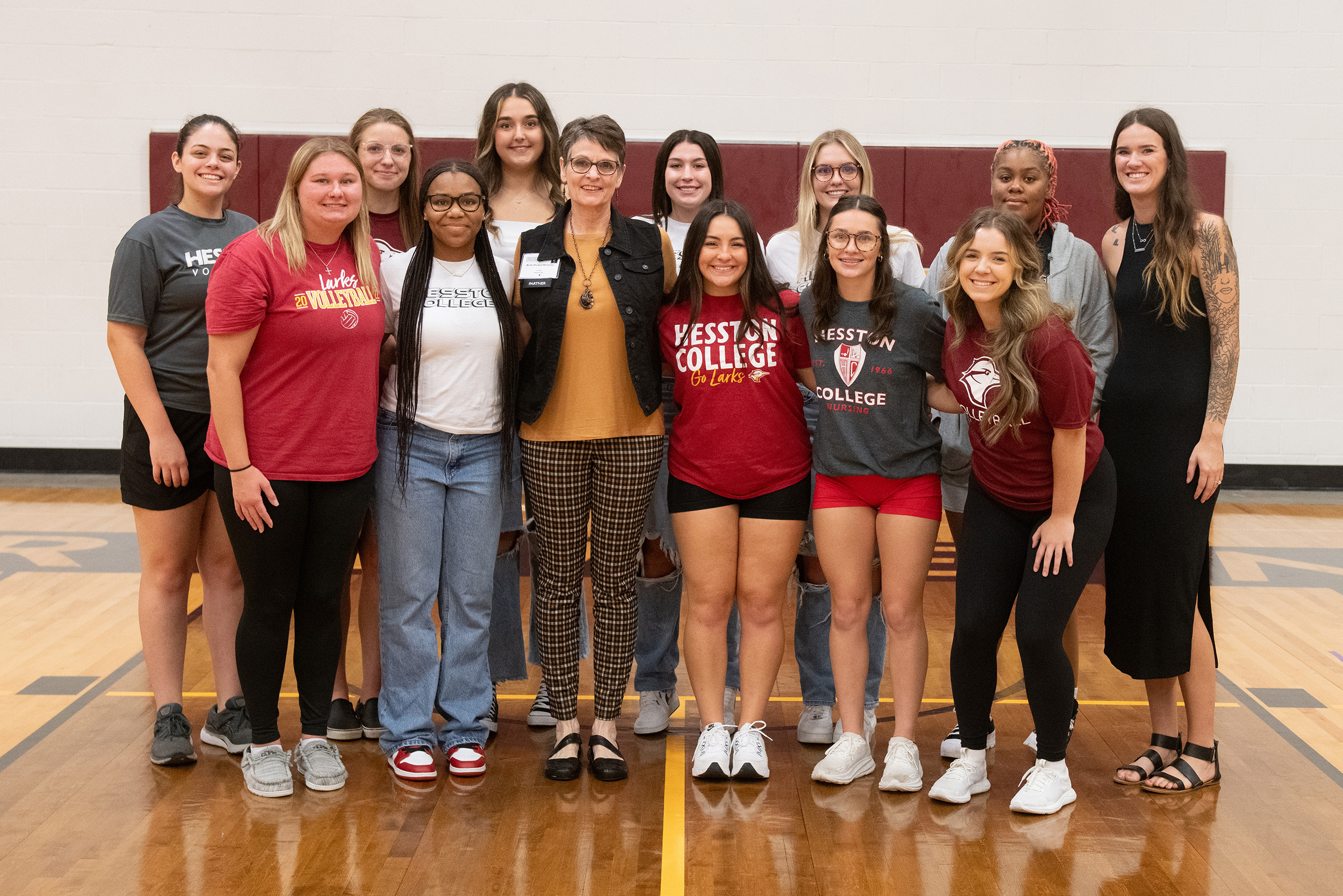 photo - Hesston College Homecoming 2023 - Athletics HoF inductees speak to teams - Beth Hostetler and volleyball
