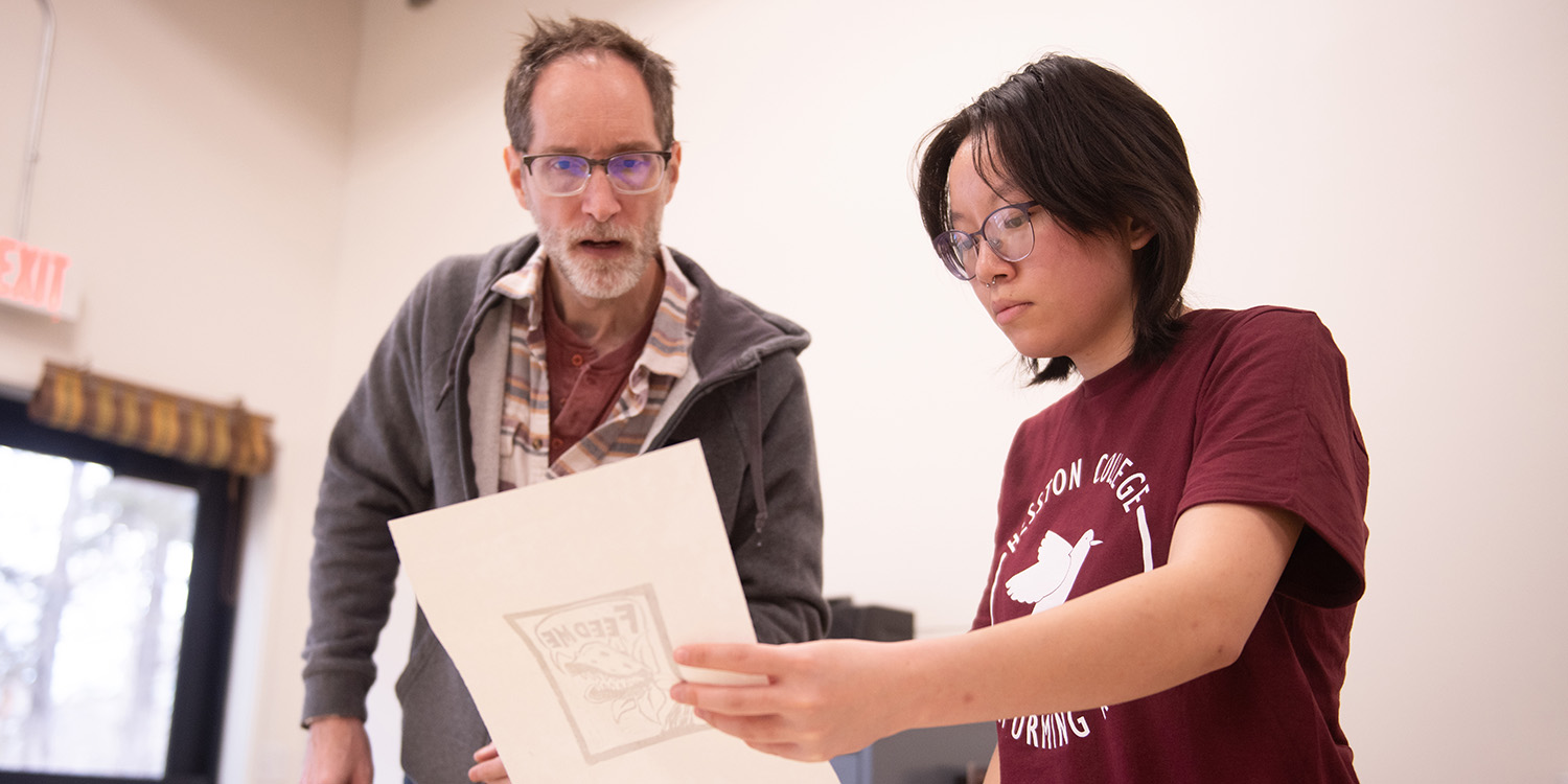Art prof Josh Cross critiques a print with freshman Jamie Krehbiel