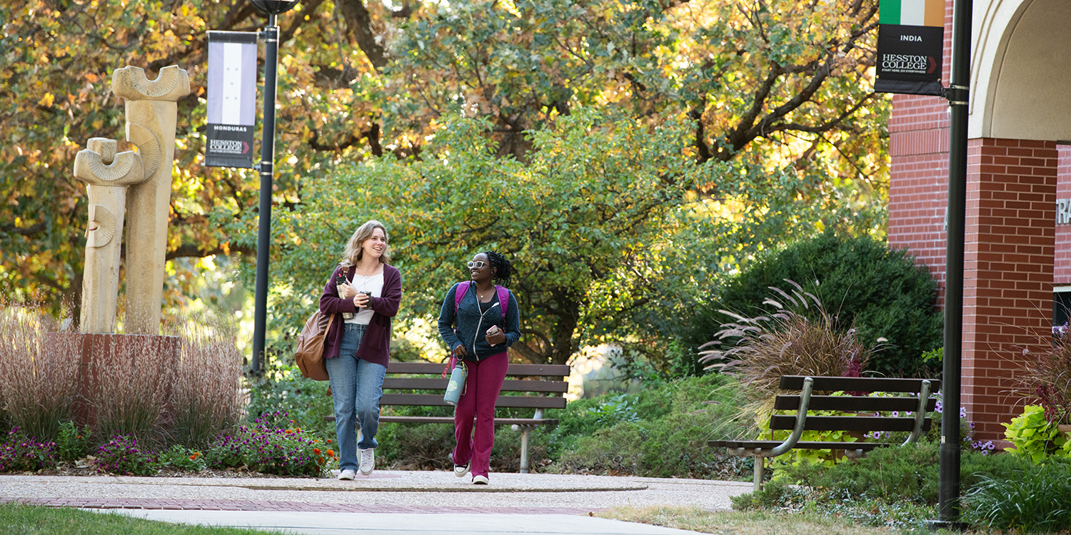 marketing photo - students walking in front of Alliman Administration Center