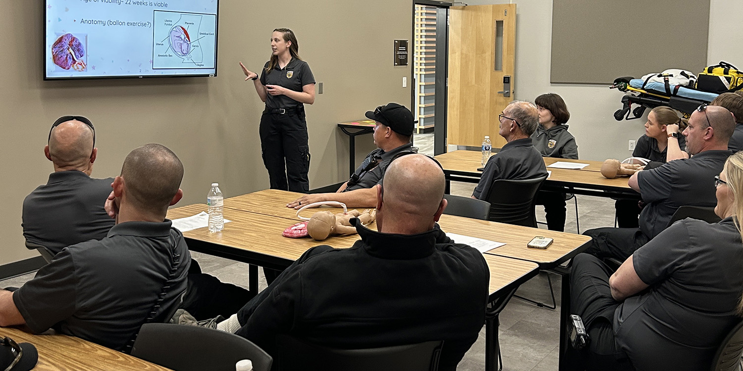 Alisha Dorsing presents a PowerPoint to Hesston Fire/EMS staff about the basics of labor and delivery in EMS and how to handle a variety of obstetric emergencies during a training session held at Hesston College.